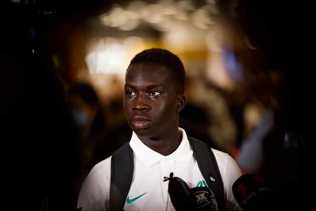 Garang Kuol of the Socceroos talks to he media on arrival at Sydney International Airport on December 05, 2022 in Sydney, Australia. (Photo by Mark Evans/Getty Images)