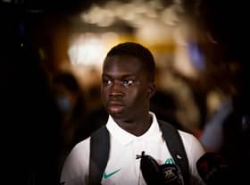 Garang Kuol of the Socceroos talks to he media on arrival at Sydney International Airport on December 05, 2022 in Sydney, Australia. (Photo by Mark Evans/Getty Images)