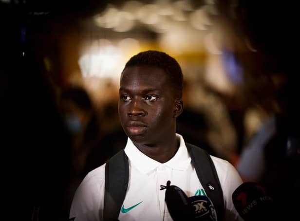 Garang Kuol of the Socceroos talks to he media on arrival at Sydney International Airport on December 05, 2022 in Sydney, Australia. (Photo by Mark Evans/Getty Images)