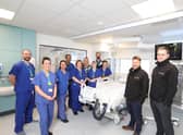 Members of the ICU and Trust estates teams alongside Tolent's representatives, as work was ongoing to complete the unit.