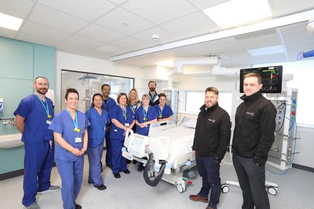 Members of the ICU and Trust estates teams alongside Tolent's representatives, as work was ongoing to complete the unit.