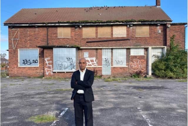 Labour Moynul Hussain  outside the Pickwick Arms pub site.