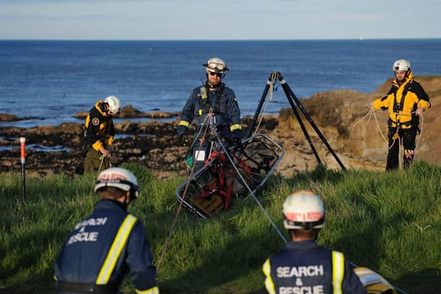 The team undergoing rope rescue training