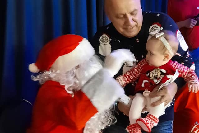 Santa Claus had the honour of meeting 10-month-old Darcy Needham at the Christmas party.