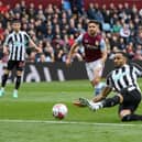 Callum Wilson of Newcastle United shoots during the Premier League match between Aston Villa and Newcastle United at Villa Park on April 15, 2023 in Birmingham, England. (Photo by Shaun Botterill/Getty Images)