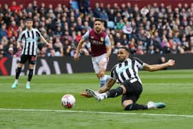 Callum Wilson of Newcastle United shoots during the Premier League match between Aston Villa and Newcastle United at Villa Park on April 15, 2023 in Birmingham, England. (Photo by Shaun Botterill/Getty Images)