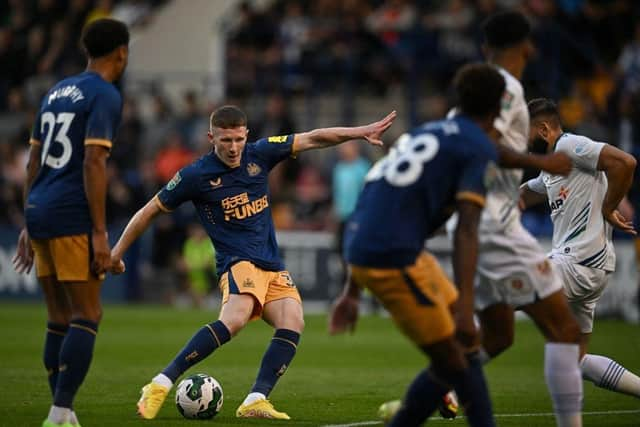 Newcastle United midfielder Elliot Anderson in action against Tranmere Rovers.