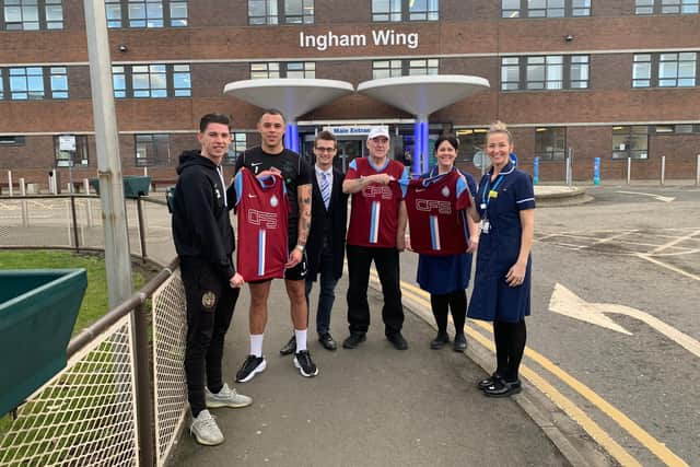 Players Jordan Hunter and Myles Boney, club sales manager Robert Reed, patient Geordie Pearce and Ward 9 Sister Ruth Linney and Ward Manager Kelly Kirkbride.