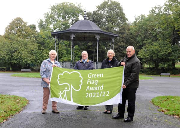 South Tyneside Council Cllr Ernest Gibson with Friends of West Park, South Shields, Chairman Gladys Hobson, Secretary Doug Mather, and Cllr Ann Hetherington, with the parks Green Flag Award.