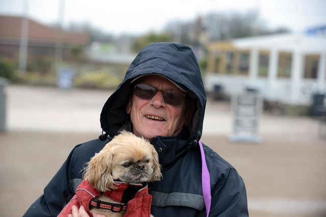 Alan Sinclair in the rain with dog Tammy.