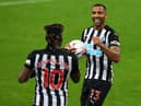 Allan Saint-Maximin congratulates Callum Wilson on his first goal against Burnley.