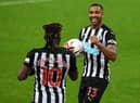 Allan Saint-Maximin congratulates Callum Wilson on his first goal against Burnley.