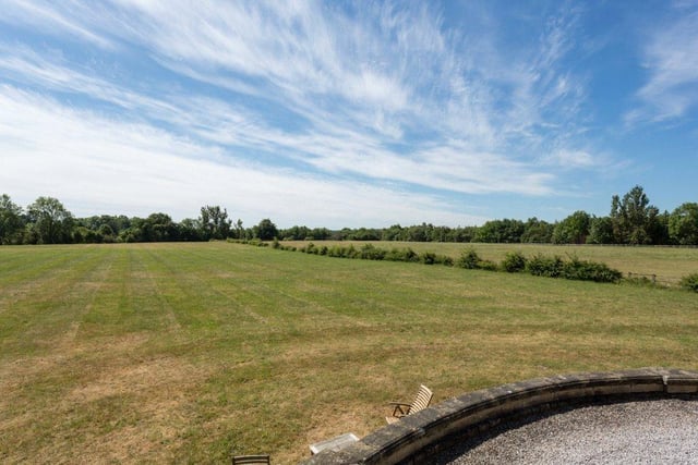The property is surrounded by beautiful rural grounds, providing plenty of space for outdoor exploring in a quiet and picturesque spot.