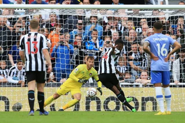 Newcastle United's Swedish striker Alexander Isak (2R) scores a penalty during the English Premier League football match between Newcastle United and AFC Bournemouth at St James' Park in Newcastle-upon-Tyne, north east England on September 17, 2022. (Photo by LINDSEY PARNABY/AFP via Getty Images)