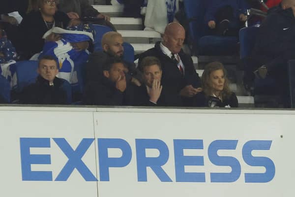Eddie Howe, centre, is seen watching the game from the stands with Jason Tindall, left, and Newcastle United part-owner Amanda Staveley, right.