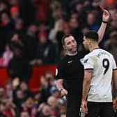 Fulham striker Aleksandar Mitrovic is sent off at Old Trafford after pushing referee Chris Kavanagh.