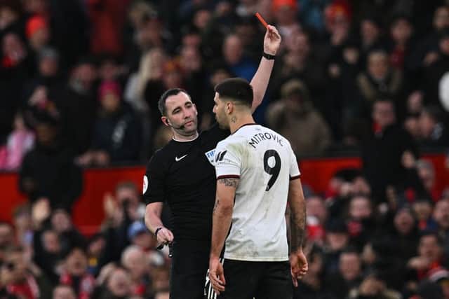 Fulham striker Aleksandar Mitrovic is sent off at Old Trafford after pushing referee Chris Kavanagh.
