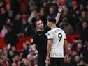 Fulham striker Aleksandar Mitrovic is sent off at Old Trafford after pushing referee Chris Kavanagh.