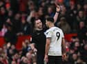 Fulham striker Aleksandar Mitrovic is sent off at Old Trafford after pushing referee Chris Kavanagh.