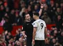 Fulham striker Aleksandar Mitrovic is sent off at Old Trafford after pushing referee Chris Kavanagh.