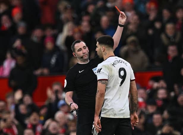 Fulham striker Aleksandar Mitrovic is sent off at Old Trafford after pushing referee Chris Kavanagh.
