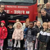 Youngsters from Nurserytime South Shields with the firefighters.