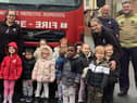 Youngsters from Nurserytime South Shields with the firefighters.