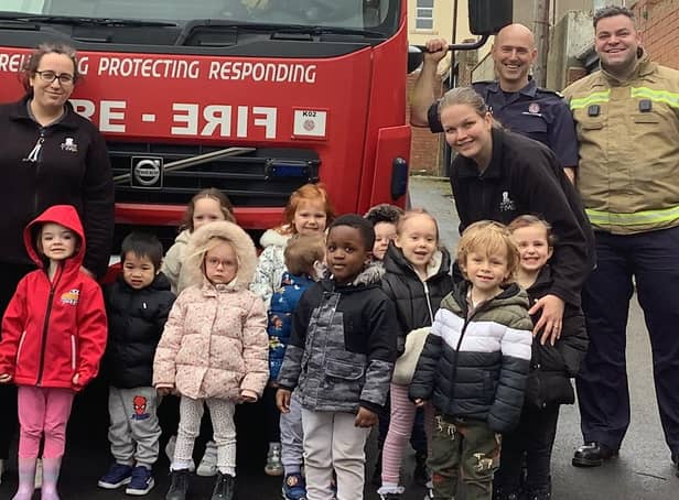 Youngsters from Nurserytime South Shields with the firefighters.