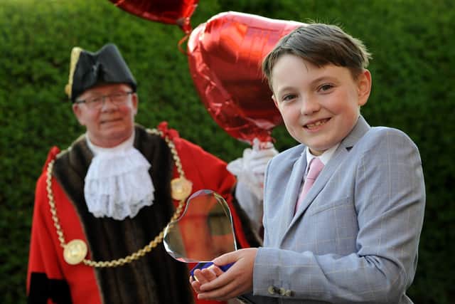 #LoveSouthTyneside winner 9-year-old Oliver Nicholson receives his award from the Mayor Cllr Norman Dick and Mayoress Mrs Jean Williamson.