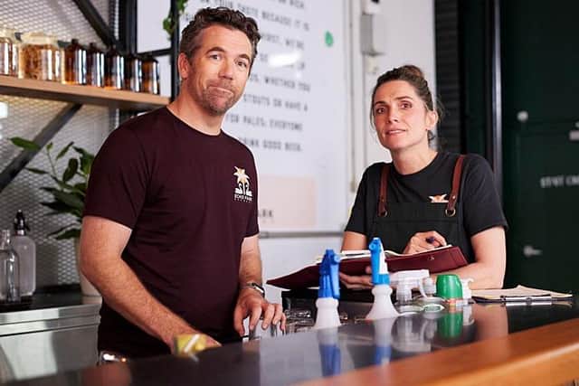 Gordon (Patrick Brammall) with his microbrewery colleague Chiara (Genevieve Hegney) in the Australian sitcom Colin From Accounts (Picture: BBC/CBS Studios/Paramount+ ©2024/Joel Pratley)