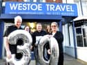 Westoe Travel owners Graeme and Joan Brett and staff from left Gillian Vogel, Martin Brett and Alice Appleby celebrate the company's 30th anniversary in 2019.