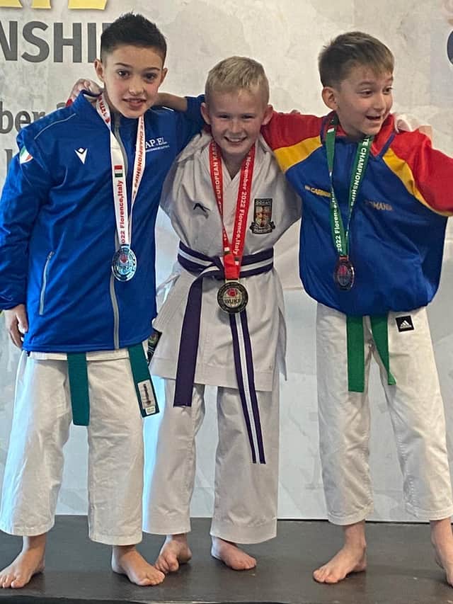 Riley Rogerson, centre, with his medal.