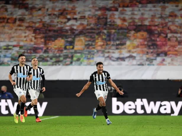 Newcastle United's English midfielder Jacob Murphy (R) celebrates after scoring the equalising goal during the English Premier League football match between Wolverhampton Wanderers and Newcastle United at the Molineux stadium in Wolverhampton, central England on October 25, 2020.