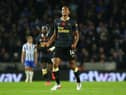 Isaac Hayden of Newcastle United celebrates after scoring their team's first goal during the Premier League match between Brighton & Hove Albion and Newcastle United at American Express Community Stadium on November 06, 2021 in Brighton, England. (Photo by Charlie Crowhurst/Getty Images)