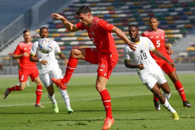 Switzerland and Newcastle United defender Fabian Schar (C) controls the ball during a friendly football match between Ghana and Switzerland in Abu Dhabi on November 17, 2022.(Photo by RYAN LIM/AFP via Getty Images)