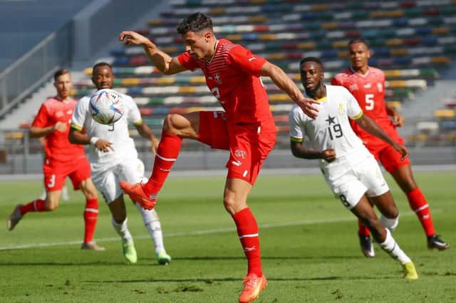 Switzerland and Newcastle United defender Fabian Schar (C) controls the ball during a friendly football match between Ghana and Switzerland in Abu Dhabi on November 17, 2022.(Photo by RYAN LIM/AFP via Getty Images)