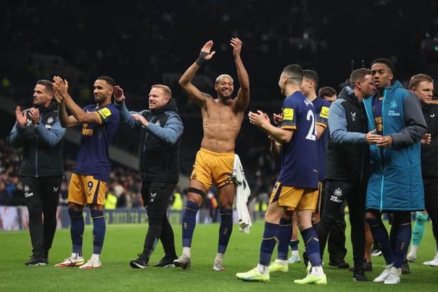 Joelinton and his Newcastle United team-mates celebrate their win over Tottenham Hotspur.