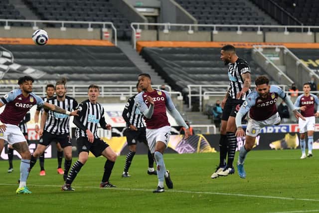 Newcastle captain Jamaal Lascelles rises above the Villa defence to head in the equalising goal during the Premier League match between Newcastle United and Aston Villa at St. James Park (Photo by Stu Forster/Getty Images)