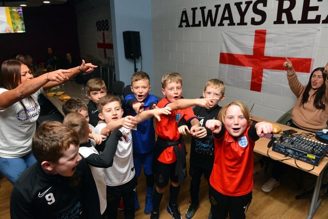 Young fans enjoying a song after England's victory.