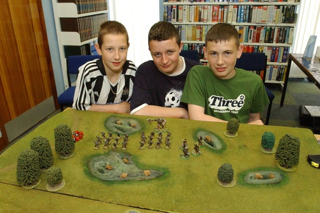 Joseph Davison, Andrew Maher and Dean McIntyre were enjoying a games workshop at the library in 2004.