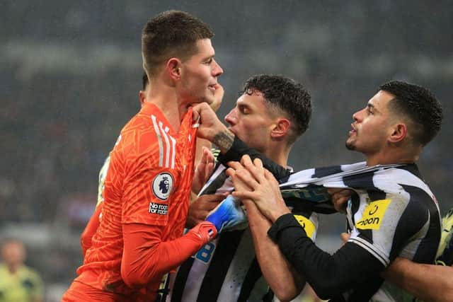 Leeds United goalkeeper Illan Meslier clashes with Newcastle United midfielder Bruno Guimaraes.