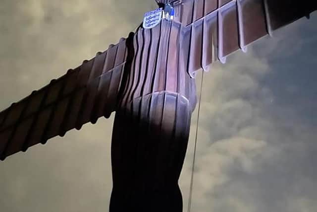 Handout photo of Ben Fada attempting to put an England badge on the Angel of the North ahead of the England football team playing in the UEFA Euro 2020 Final on Sunday. Issue date: Saturday July 10, 2021.