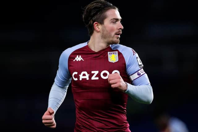 Jack Grealish of Aston Villa looks on during the Premier League match between Brighton & Hove Albion and Aston Villa at American Express Community Stadium on February 13, 2021 in Brighton, England. Sporting stadiums around the UK remain under strict restrictions due to the Coronavirus Pandemic as Government social distancing laws prohibit fans inside venues resulting in games being played behind closed doors.