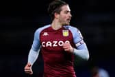 Jack Grealish of Aston Villa looks on during the Premier League match between Brighton & Hove Albion and Aston Villa at American Express Community Stadium on February 13, 2021 in Brighton, England. Sporting stadiums around the UK remain under strict restrictions due to the Coronavirus Pandemic as Government social distancing laws prohibit fans inside venues resulting in games being played behind closed doors.
