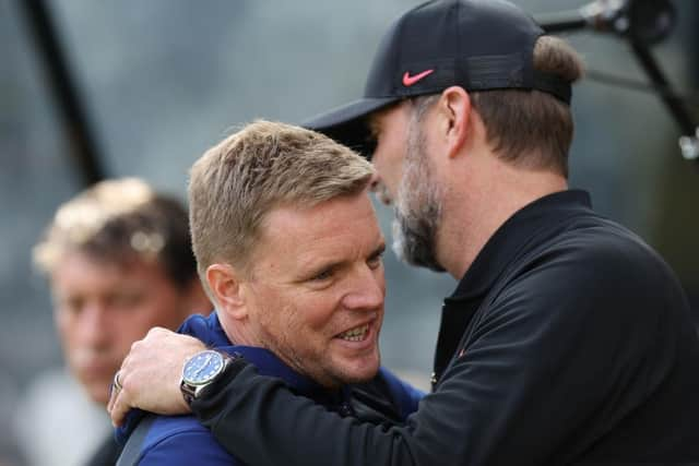 Eddie Howe, Manager of Newcastle United embraces Juergen Klopp, Manager of Liverpool prior to the Premier League match between Newcastle United and Liverpool at St. James Park on April 30, 2022 in Newcastle upon Tyne, England. (Photo by Ian MacNicol/Getty Images)