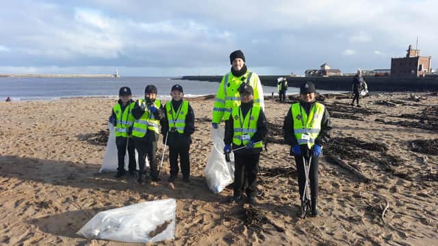 PCSO Steve Lorrison with Mini Police volunteers on the beach in South Shields.