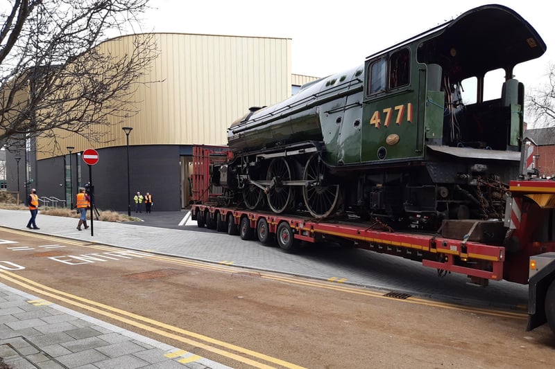 Green Arrow turns towards the Doncaster museum entrance