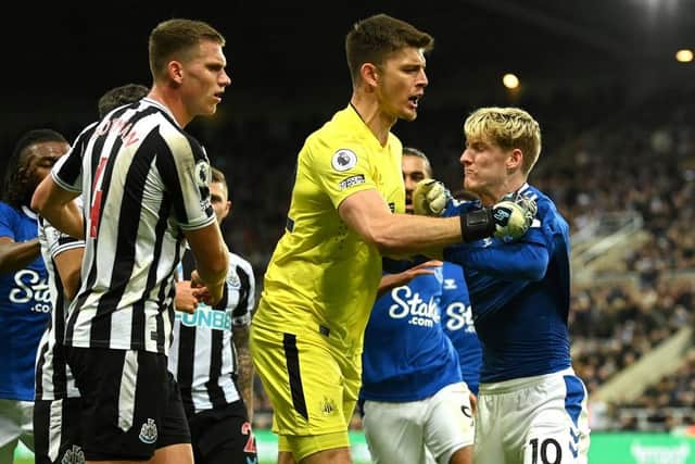 New Newcastle United signing Anthony Gordon clashes with Nick Pope and Sven Botman while playing for Everton in October.