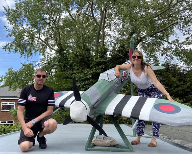 Fenwick Avenue residents Darren and Victoria Hanson with a Spitfire plane they created to commemorate the anniversary of VE Day during their street party last year.