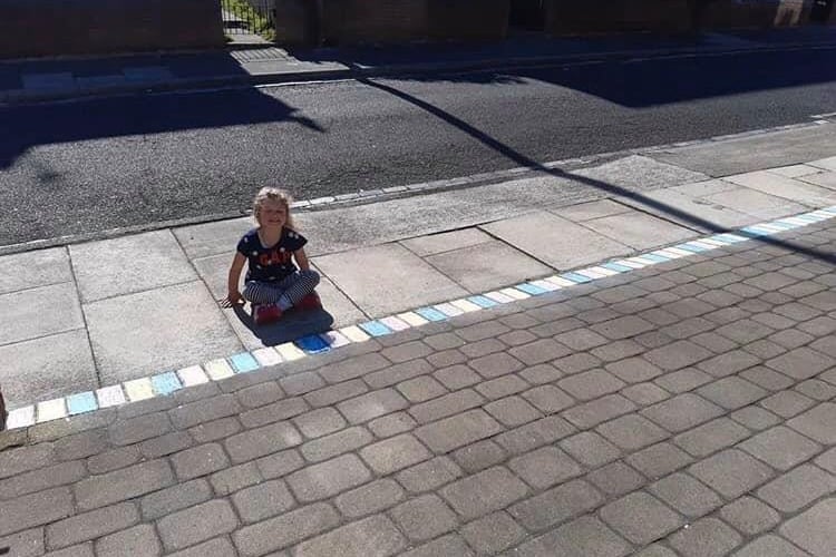 Patsy Trotter shared this photo with the caption: "My ray of sunshine Freya Wilson my granddaughter aged 5 doing her bit to say thank you 🌈👏🌈👏 x"